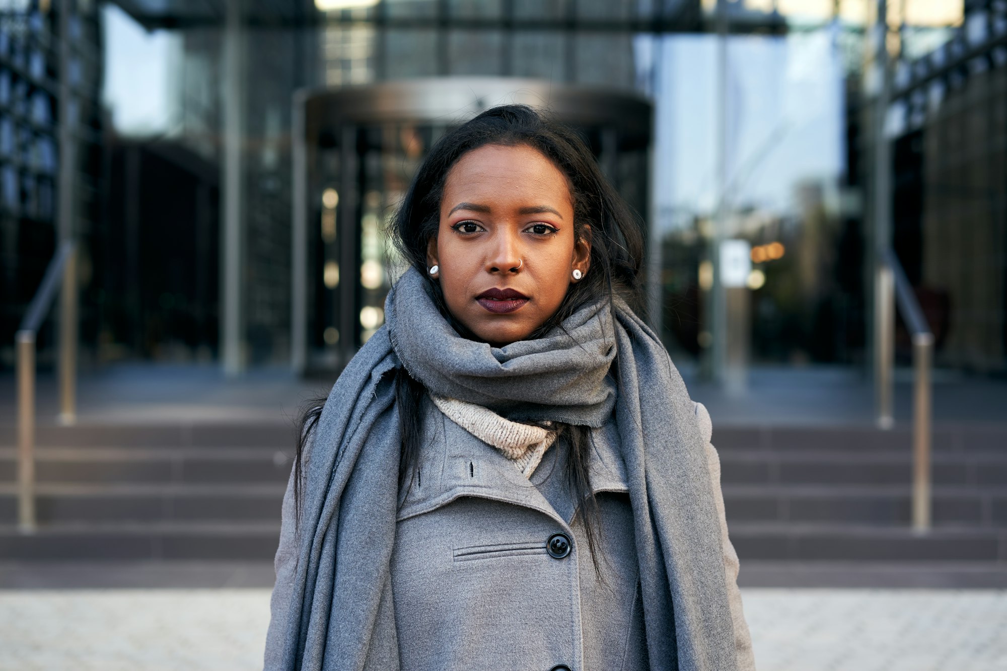 Young serious African American businesswoman looking camera. Empowered lady in a corporate place